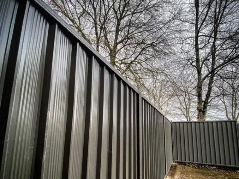 Steel privacy fence installation in British Columbia